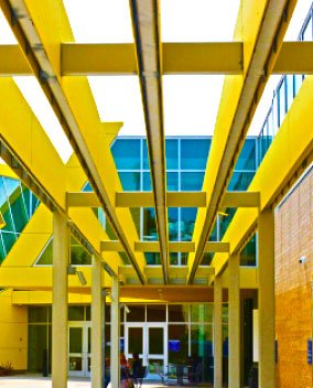 yellow sculptural elements on building