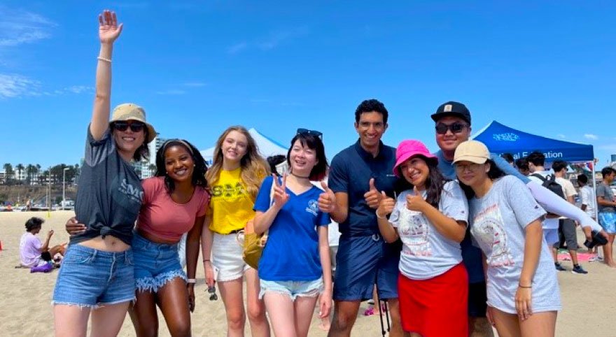 happy students on the beach