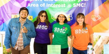 smiling staff in colorful shirts
