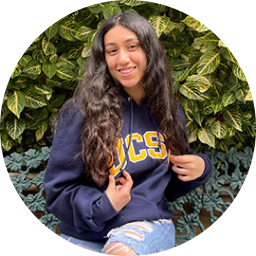 smiling woman in UCS shirt